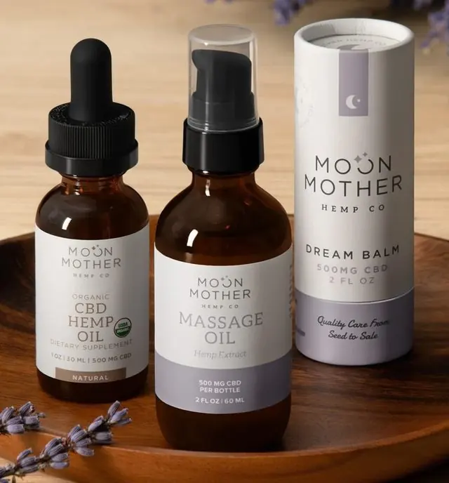 CBD Hemp Oil, Massage Oil and Dream Balm on a wooden tray with lavender