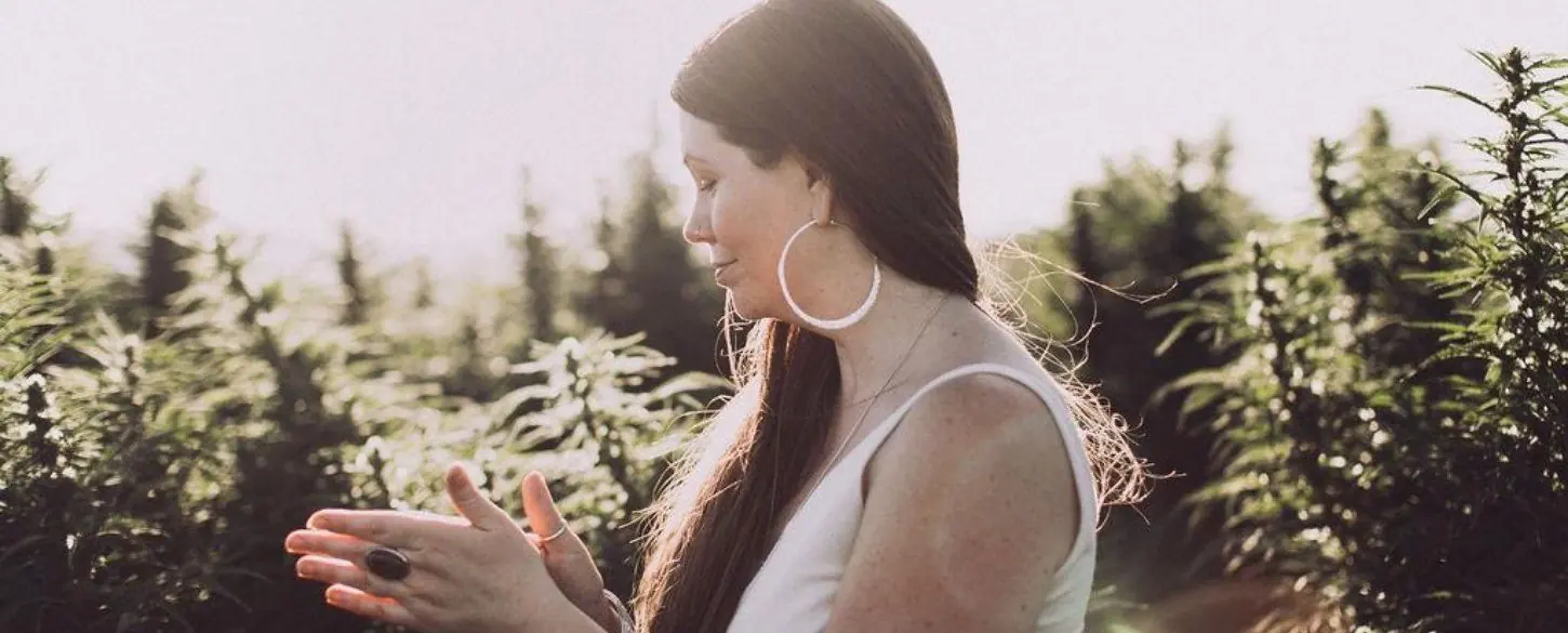 Jessica among the hemp plants